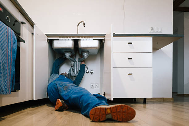Professional Emergency Plumber technician working in Grand Haven, MI
